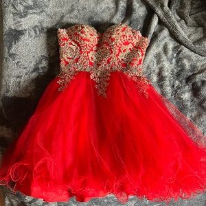Red homecoming dress with gold rose and crystal design and corset back